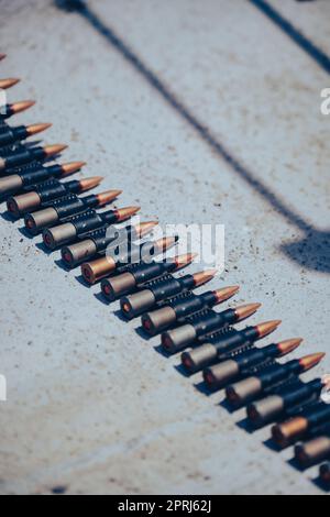 Machine gun belt loaded with cartridges Stock Photo