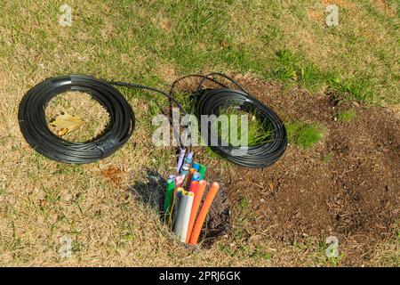 Cables with optical fiber for the Internet laid underground Stock Photo