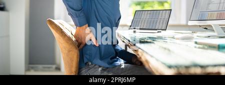 Man With Back Pain Stock Photo