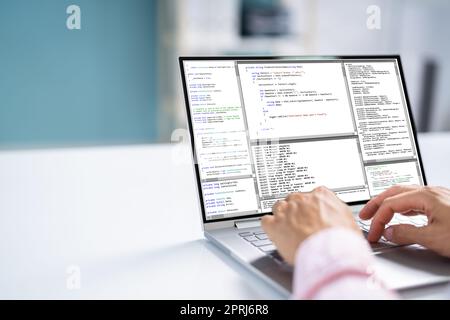 Computer Programmer Using Development Software Stock Photo