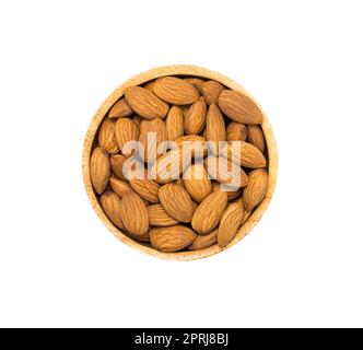Almonds in wooden bowl on white background, top view. Stock Photo