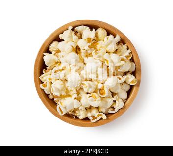 Popcorn in a wooden bowl placed on a white background. Stock Photo