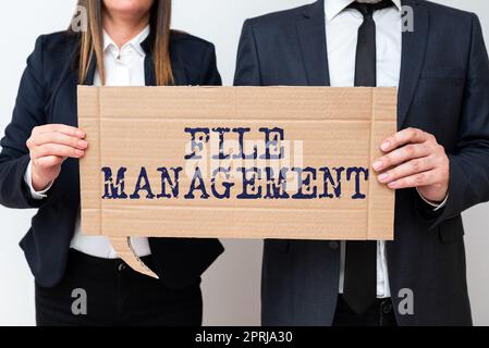Hand writing sign File Managementcomputer program that provides user interface to manage data. Business showcase computer program that provides user interface to manage data Stock Photo