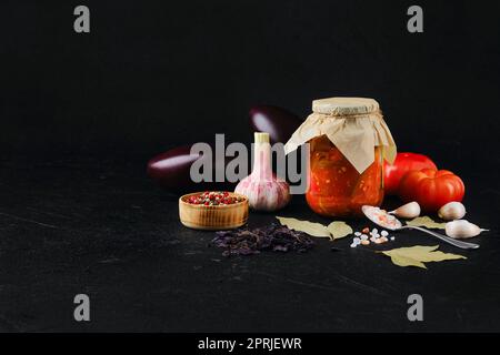 Fried eggplant with bell pepper, garlic and spices preserved in tincan Stock Photo