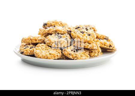 Wholegrain oat cookies. Cookies with oatmeal and raisins isolated on the white table. Stock Photo