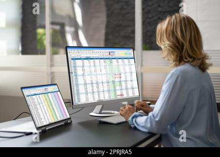Data Analyst Woman Using Spreadsheet Stock Photo