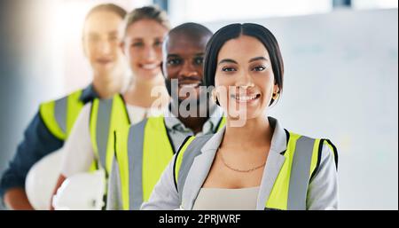 Diversity, team and portrait of engineering employees standing in an industrial office. Industry workers working on a site development project together in a corporate room at the staff warehouse. Stock Photo