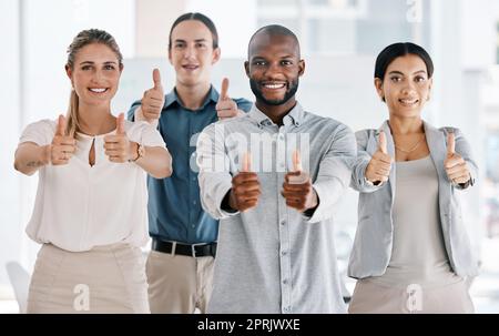 Diversity, team and thumbs up of business people in teamwork agreement for success at the office. Group of diverse employee workers together in collaboration in agree, yes or thank you hand gestures Stock Photo