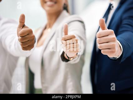 Thumbs up for corporate success, support with hand sign for business collaboration and thank you for partnership in work office. Team trust, employee motivation and diversity at startup company Stock Photo