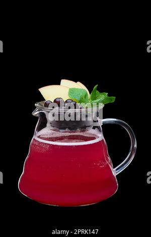 Apple and black currant hot tea isolated on black. Healthy raw food concept. Photo with clipping path. Stock Photo