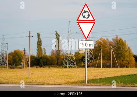 Give way sign at a roundabout. Circular motion. Traffic signs Stock ...