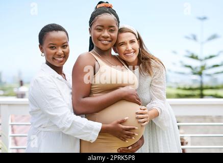 Id never want to celebrate with anyone else. a group of women taking photos during a baby shower Stock Photo