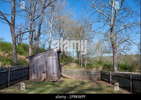 Rustic free range wooden chicken coop with fence on idyllic farm Stock Photo