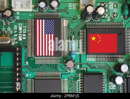 Chip production and trade war between America and China. America and china flag on chips. Chip manufacturer countries of the World. Stock Photo