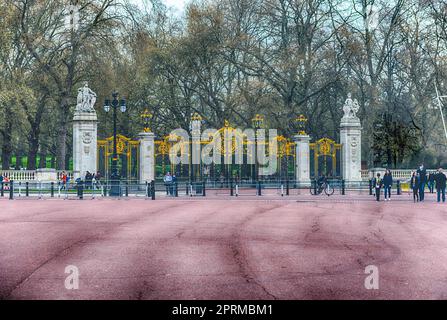 LONDON - APRIL 11, 2022: Gate with gilded ornaments in Buckingham Palace, one of the main tourist attractions in London, England, UK Stock Photo