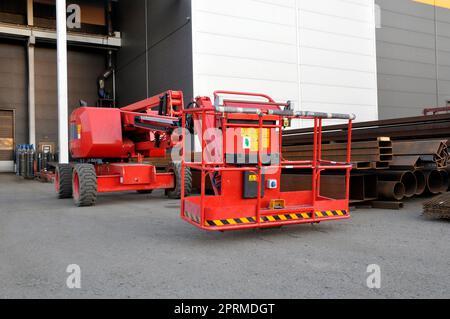 Modern construction hydraulic lift. Air basket. Construction equipment. Stock Photo