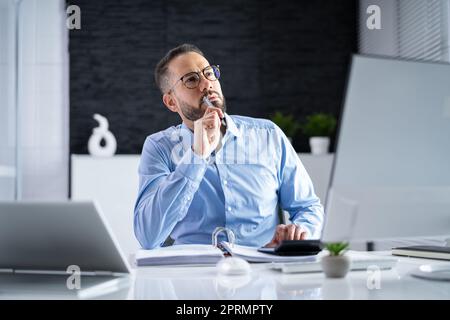Chartered Business Accountant In Office Stock Photo