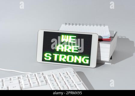 Text caption presenting We Are Strong. Word for Have great strength healthy powerful achieving everything Stock Photo