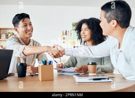 Handshake, global partnership and office deal in business meeting with man and women for diversity support, trust or crm. Smile, happy and success creative teamwork in b2b collaboration in strategy Stock Photo