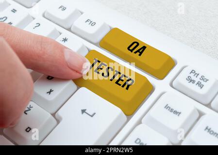 Writing displaying text Qa Tester, Word for Quality assurance of an on going project before implementation Stock Photo