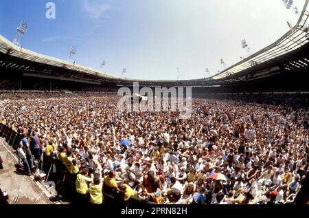 File photo dated 13-07-1985 of The huge crowd at Wembley Stadium, London for the Live Aid concert. A huge crowd gathered for the Live Aid charity concert held at Wembley Stadium on July 13, 1985 to raise money for victims of the famine in Ethiopia. Issue date: Thursday April 27, 2023. Stock Photo