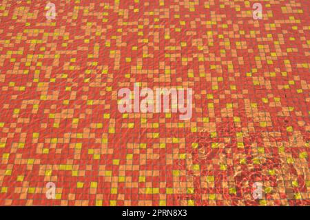 Paving red-yellow tile the pool Stock Photo - Alamy