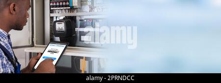 Technician Reading Electric Meter. Electrician Looking At Counter Stock Photo