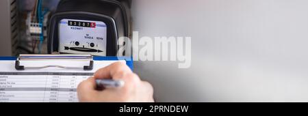 Electricity Counter Metering System. Engineer Reading Meter Stock Photo