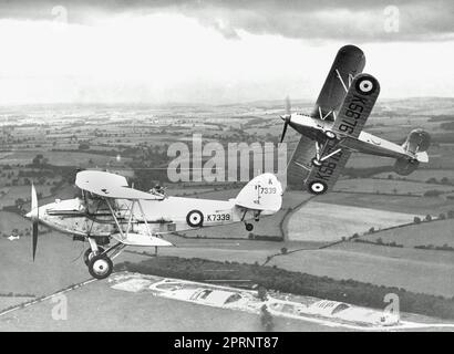 Royal Air Force Hawker Audax light bomber and Hawker Fury fighter air exercise in the late 1930s. Stock Photo