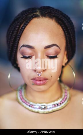 Adorning her body with beauty. an attractive young woman with piercings. Stock Photo