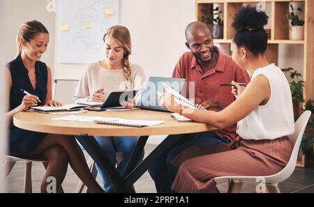 Corporate team, brainstorming and meeting table for idea collaboration session in diverse office. Employee development, solidarity and teamwork strategy for business workplace innovation workshop. Stock Photo