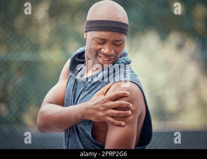 Sports arm injury, black man massage exercise pain and emergency. First aid on muscle, fitness accident and holding bicep. Frustrated person, tennis ache and athlete stress from outdoor training Stock Photo