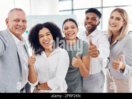 Happy business people or team with thumbs up at office for success, diversity and solidarity at company office. Global or international startup group, corporate staff or management in unity and trust Stock Photo