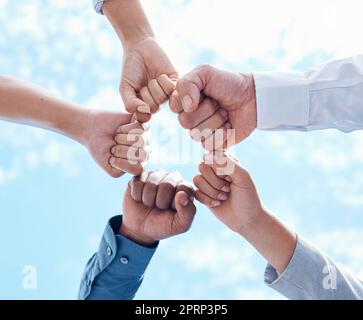 Teamwork collaboration, diversity fist bump and mission success of business. Partnership support, community team building goal and people group together. Contact us, we are hiring and staff hands Stock Photo