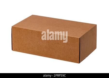 Closed brown cardboard box or kraft paper box with clipping path isolated on white background. Suitable for packaging. Macro. Stock Photo