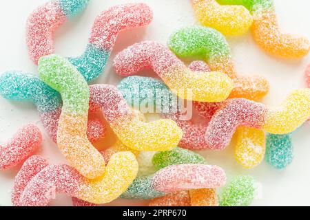 Colorful tasty jelly candies on a white background, top view. Stock Photo