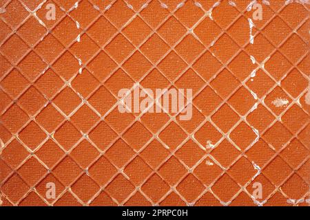 Close-up of detailed dirty texture reverse side of the ceramic tile. Rough embossed lattice. Stock Photo
