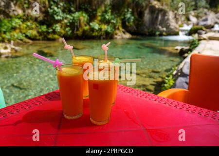 orange juice, riverside restaurant, God's Bridge, Akchour, Talassemtane Nature Park, Rif region, morocco, africa Stock Photo