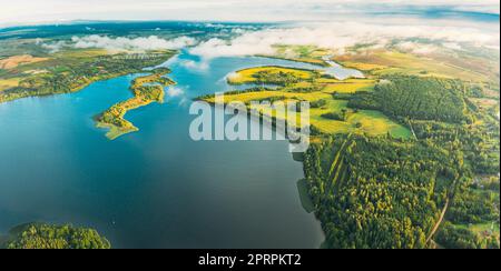 Lyepyel District, Lepel Lake, Beloozerny District, Vitebsk Region. Aerial View Of Residential Area With Houses In Countryside. Morning Fog Above Lepel Lake. Top View Of European Nature From High Attitude In Autumn. Bird's Eye View Of Old Lyepyel Cityscape Stock Photo