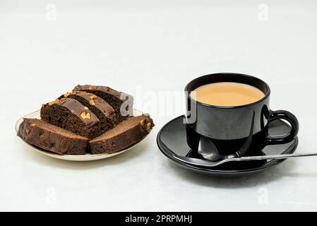 plum cake, hot tea with milk, plum cake with tea, hot tea with milk Stock Photo