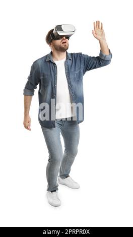 Emotional man using virtual reality headset on white background Stock Photo