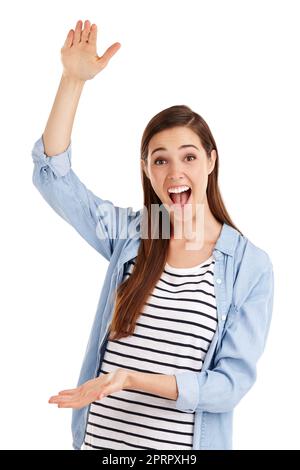 Im not kidding, its this big. Studio shot of a beautiful young woman indicating a large size with her hands against a white background. Stock Photo