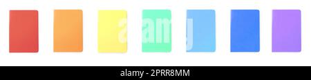 Set with multicolor notebooks on white background, top view. Banner design Stock Photo