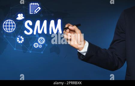 Social media marketing concept. Man using virtual icon SMM against color background, closeup Stock Photo