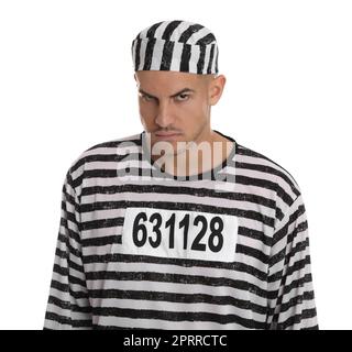 Prisoner in striped uniform on white background Stock Photo