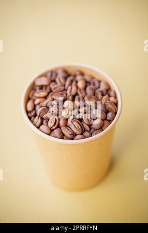 Freshly roasted coffee beans in a cup Stock Photo