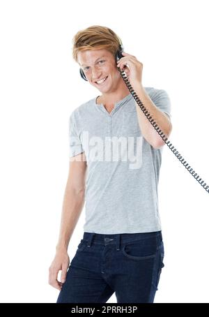 Feeling confident and looking casual. Studio portrait of a handsome young man with ginger hair. Stock Photo