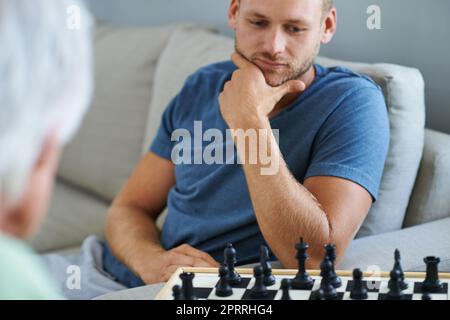 Elderly Man Contemplating Next Chess Move Stock Photo - Download Image Now  - Active Lifestyle, Active Seniors, Adult - iStock