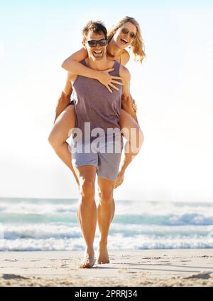 Cute portrait of couple. Guy rolls a girl on his back Stock Photo - Alamy