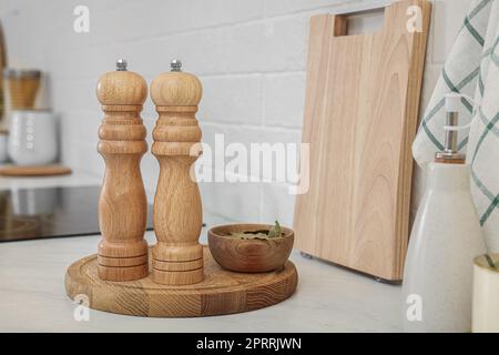 Wooden Salt And Pepper Shakers With Bay Leaves On Light Table, Closeup.  Spice Mill Stock Photo, Picture and Royalty Free Image. Image 174031811.